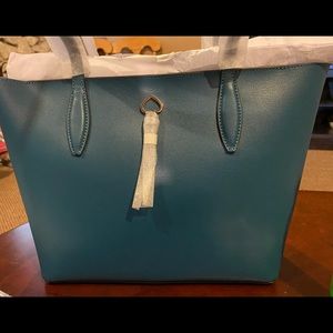 Kate spade medium tote. 11.5W X 9.H Peacock in color zipper